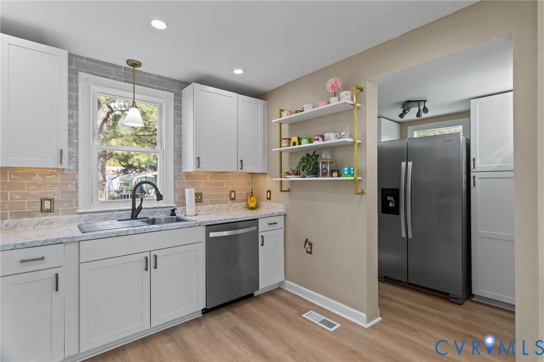 6101 River Road Petersburg, VA 23803 - Photo 13 of 37 Kitchen with stainless steel appliances, white cab