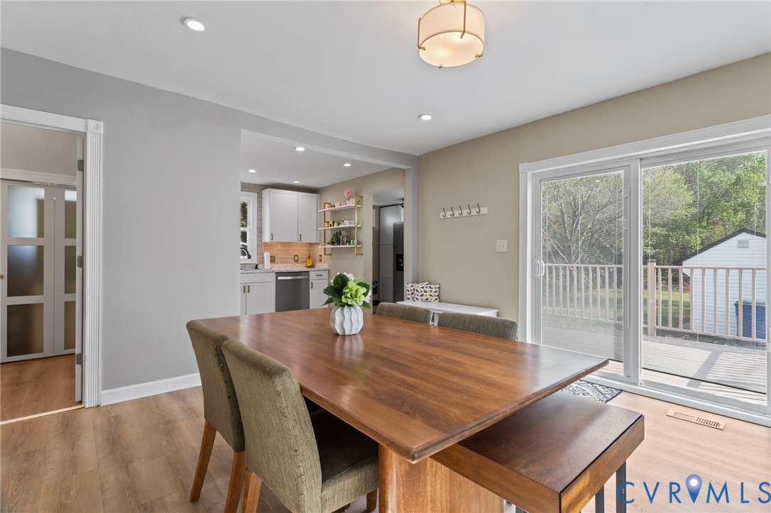 6101 River Road Petersburg, VA 23803 - Photo 16 of 37 Dining Room with LVP flooring sliding door to deck