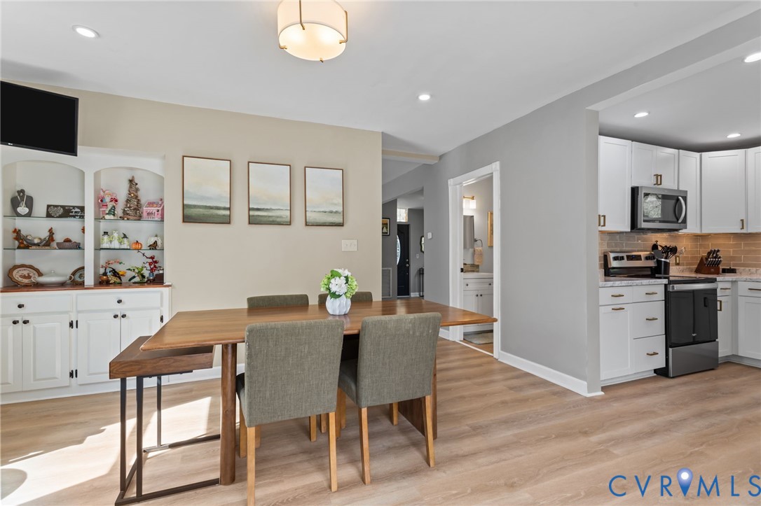 6101 River Road Petersburg, VA 23803 - Photo 18 of 37 Dining Room with LVP flooring sliding door to deck