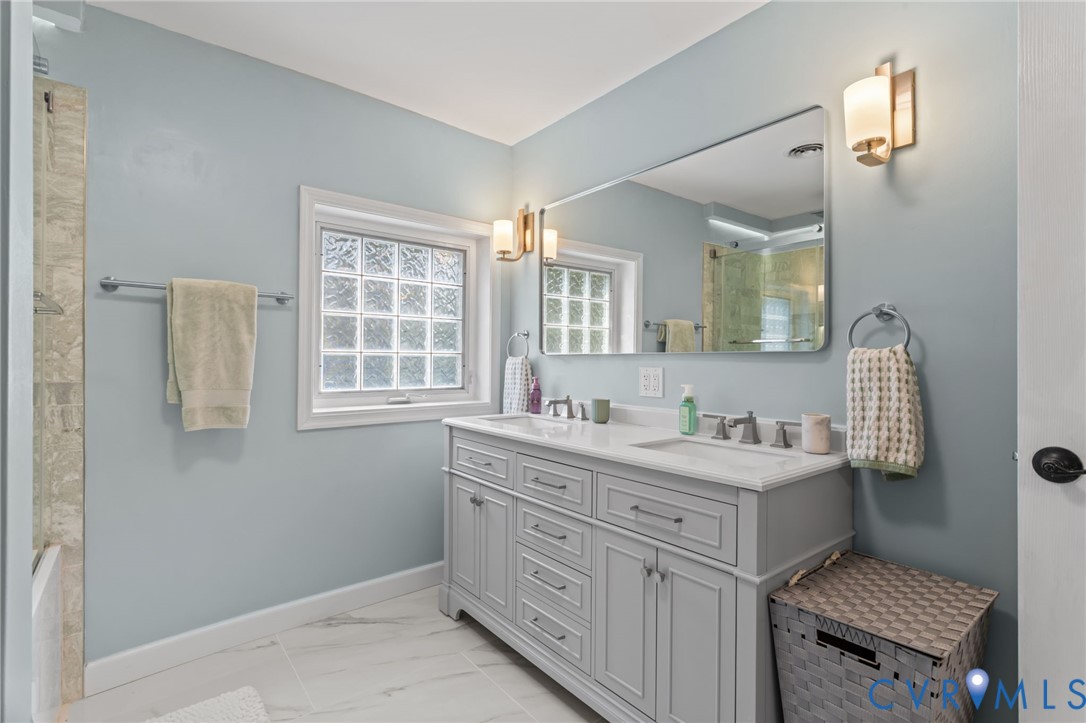 6101 River Road Petersburg, VA 23803 - Photo 24 of 37 Upstairs full bathroom with double vanity, a showe