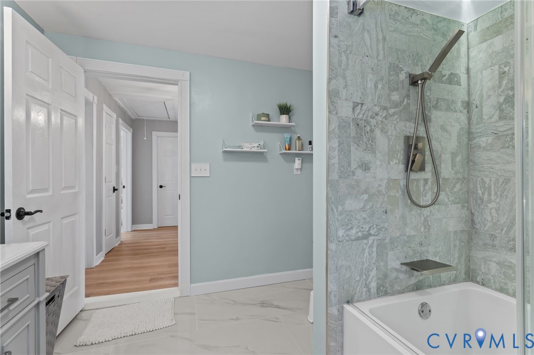 6101 River Road Petersburg, VA 23803 - Photo 26 of 37 Upstairs full bathroom with double vanity, a showe