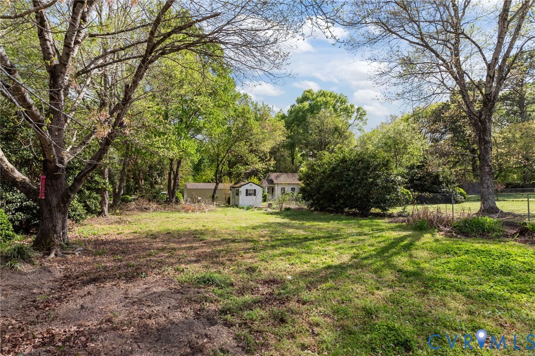 6101 River Road Petersburg, VA 23803 - Photo 36 of 37 View of yard with view of scattered trees and a st