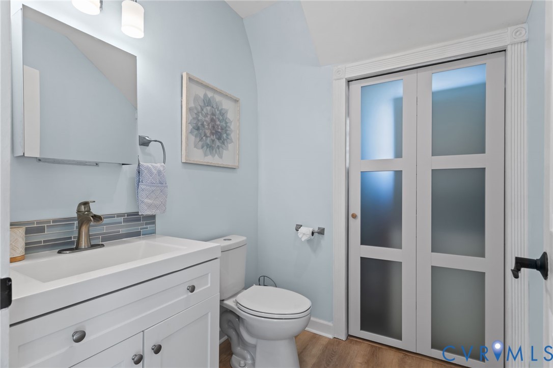 6101 River Road Petersburg, VA 23803 - Photo 9 of 37 1st floor half bathroom with vanity, LVP floors, a