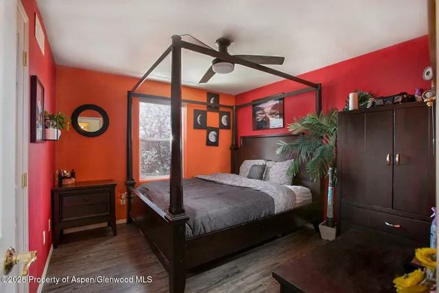 a bedroom with bed and a window