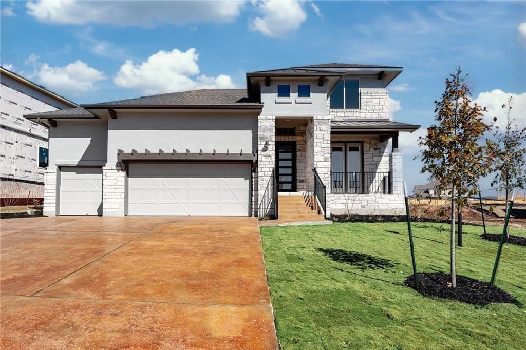 612 Rawson Bend Austin, TX 78738 - Photo 1 of 1 a front view of a house with a yard