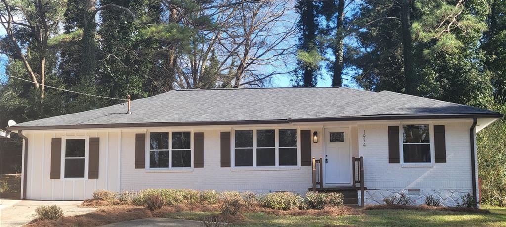 1974 Rosewood Road Decatur, GA 30032 - Photo 1 of 1 a front view of a house with a yard