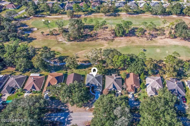 an aerial view of residential house with outdoor space and lake view