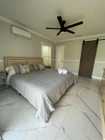 a view of an empty room and a window