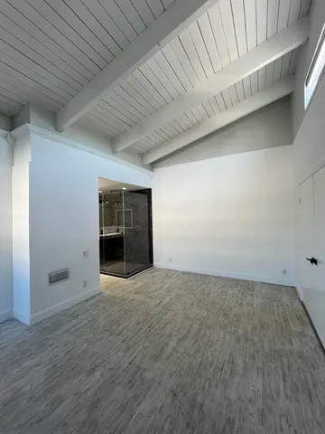 a big house with a big yard and large trees