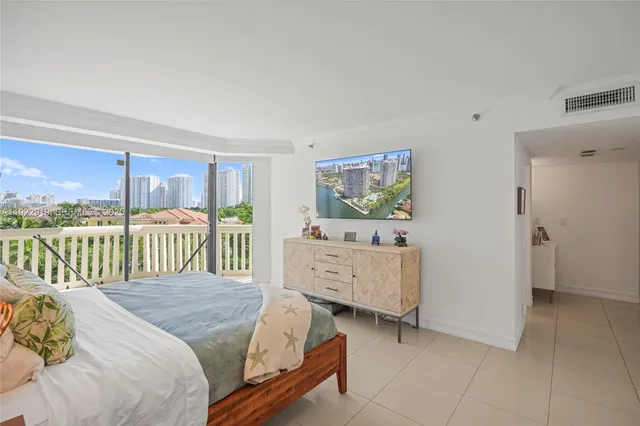 a bed room with a bed and a dresser