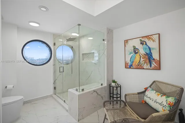 a living room with furniture and a mirror