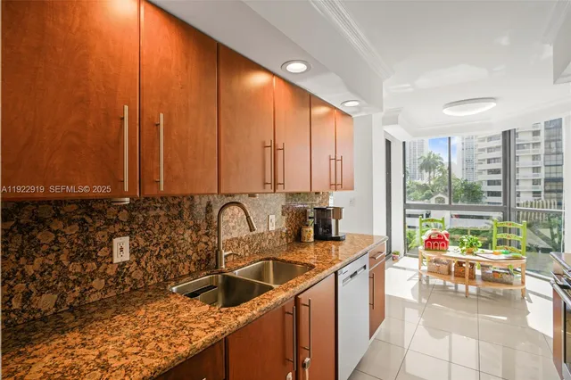 a kitchen with a large window and a sink