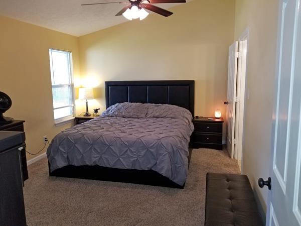 3104 Country Way Road Antioch, TN 37013 - Photo 9 of 11 a bedroom with a bed and a chandelier