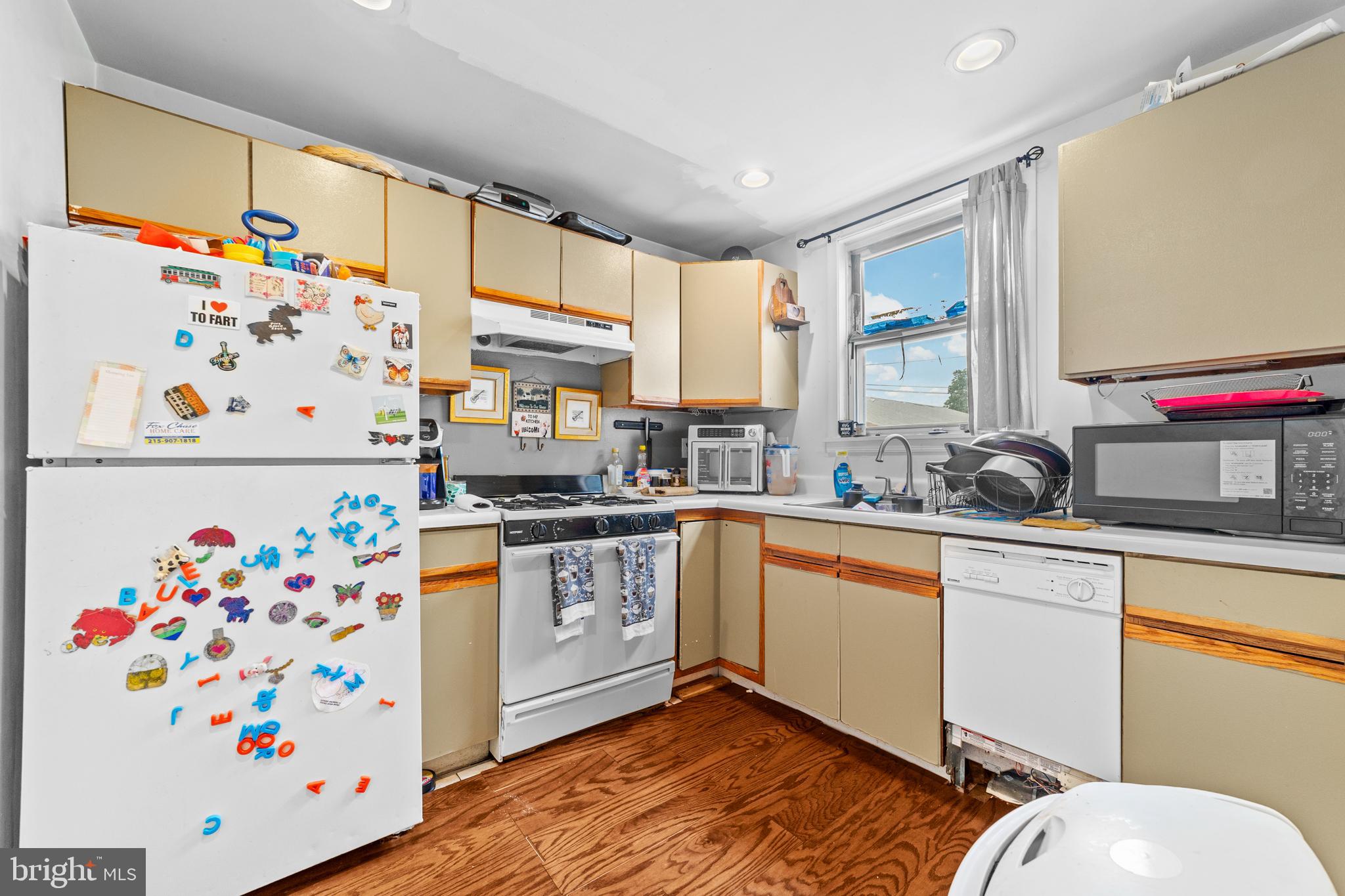 7333-35 Rising Sun Avenue Philadelphia, PA 19111 - Photo 12 of 28 a kitchen with stainless steel appliances a stove a sink and a refrigerator