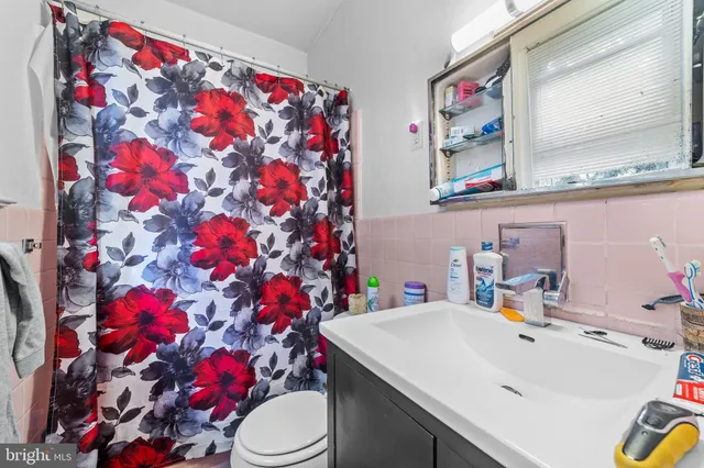 a bathroom with a sink mirror and vanity