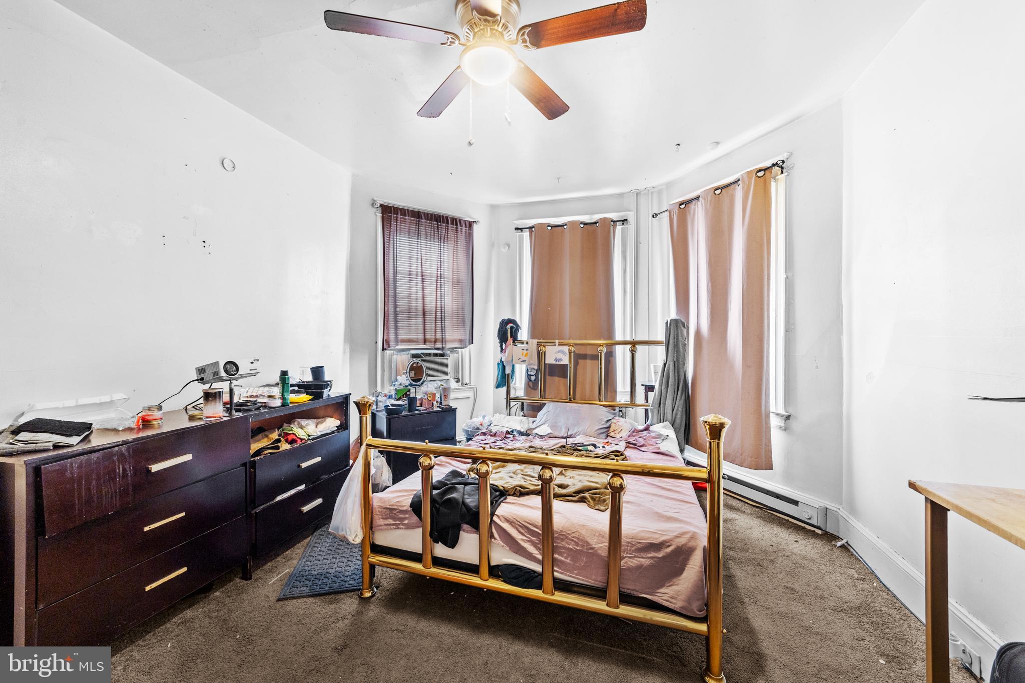 7333-35 Rising Sun Avenue Philadelphia, PA 19111 - Photo 19 of 28 a bed room with furniture and window