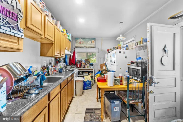 a view of a kitchen with lots of stuff