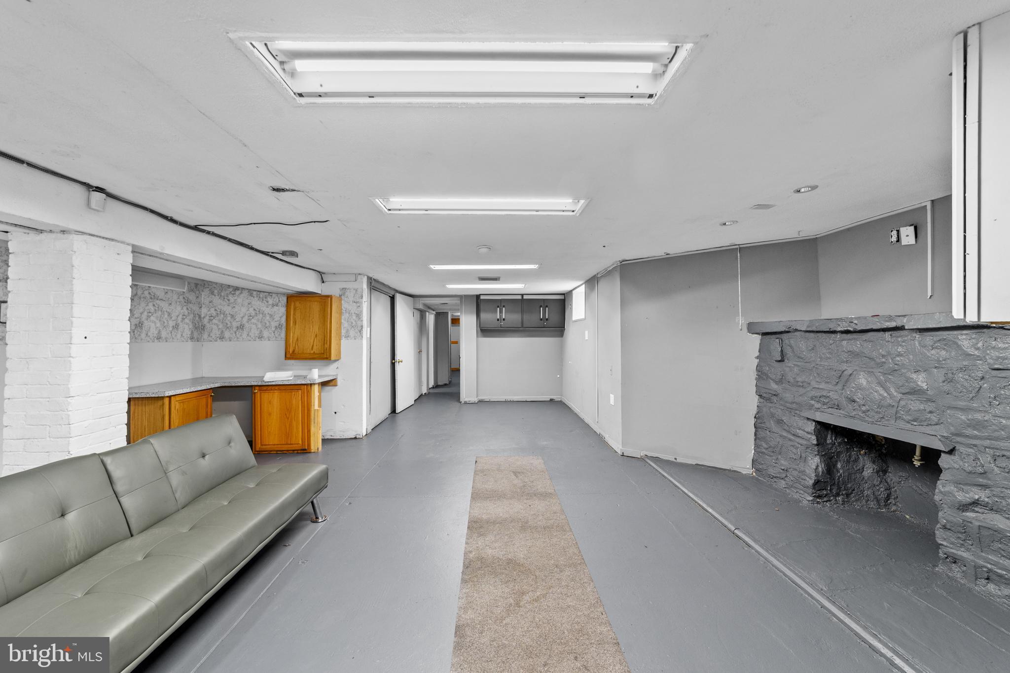 7333-35 Rising Sun Avenue Philadelphia, PA 19111 - Photo 24 of 28 a living room with furniture and a fireplace