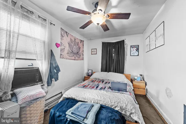 a bedroom that has a bed and a chandelier