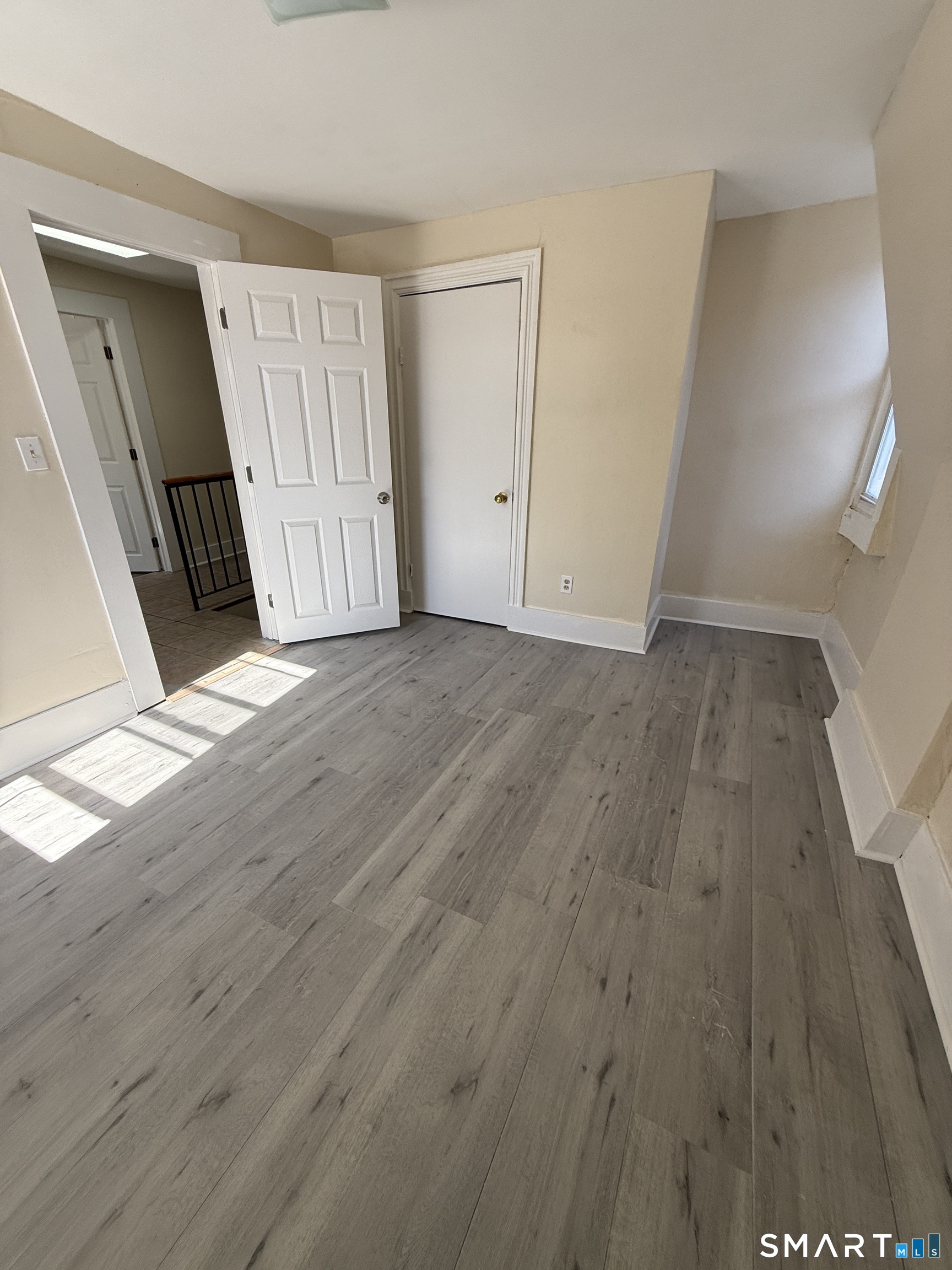 35 Cliff Street Norwich, CT 06360 - Photo 11 of 21 a view of a livingroom with wooden floor and stairs