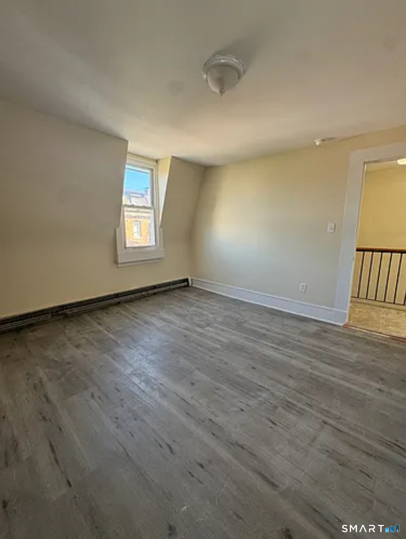 35 Cliff Street Norwich, CT 06360 - Photo 15 of 21 wooden floor in an empty room with a window