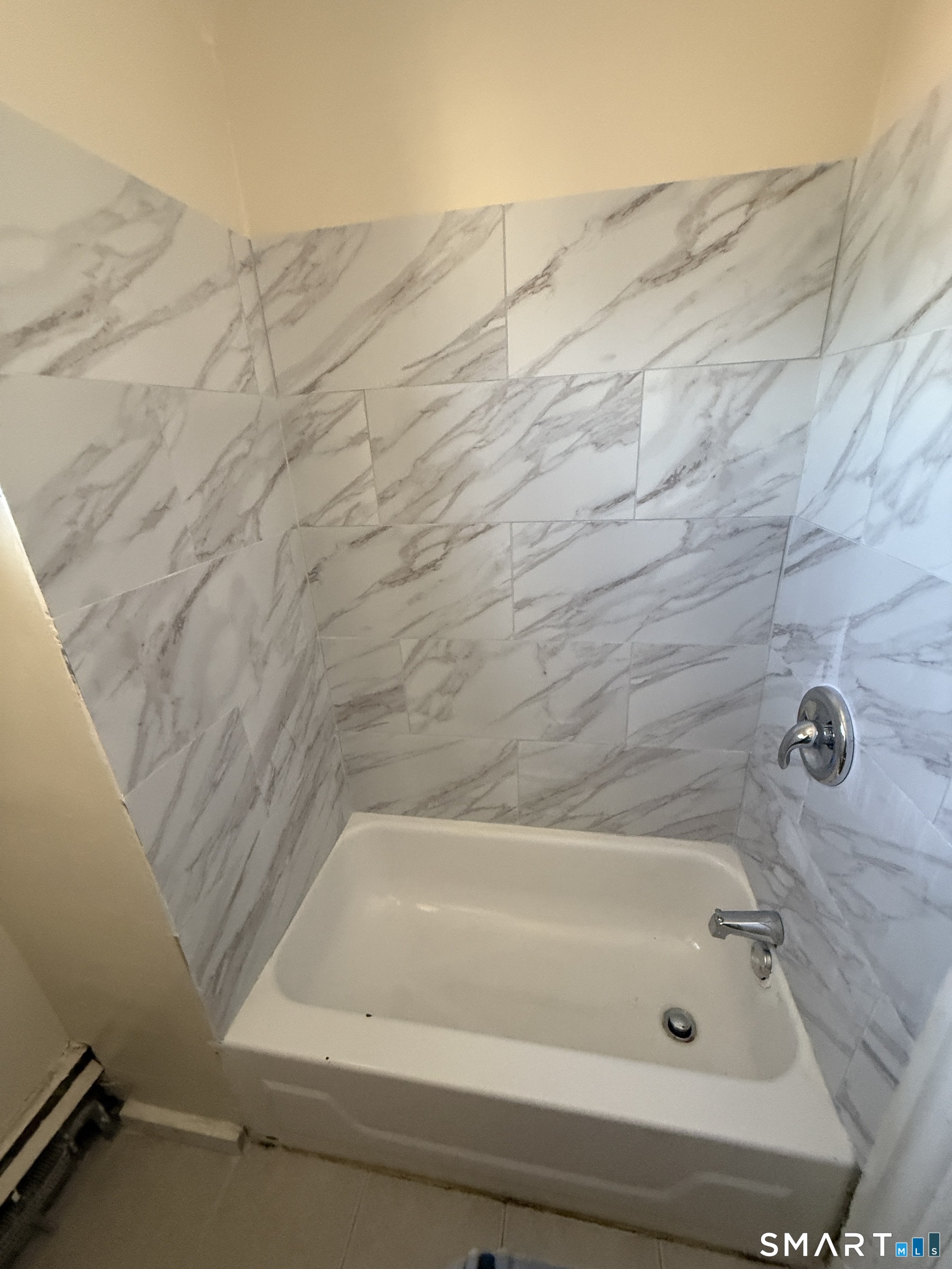 35 Cliff Street Norwich, CT 06360 - Photo 16 of 21 a bathroom with a bathtub