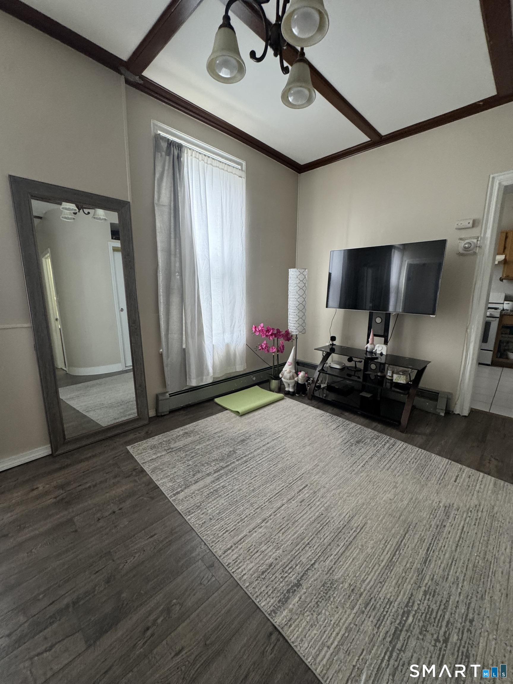 35 Cliff Street Norwich, CT 06360 - Photo 17 of 21 a room with wooden floor and gym equipment