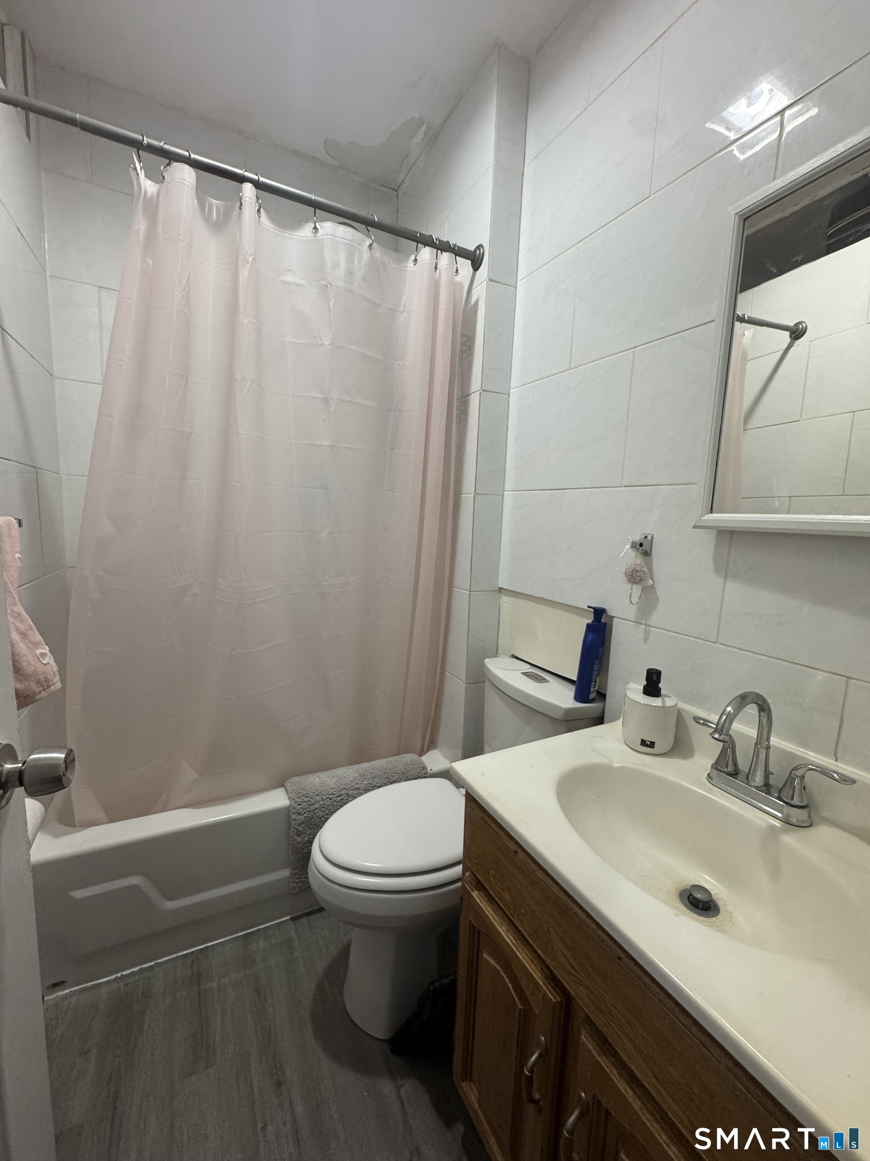 35 Cliff Street Norwich, CT 06360 - Photo 19 of 21 a bathroom with a sink and a toilet