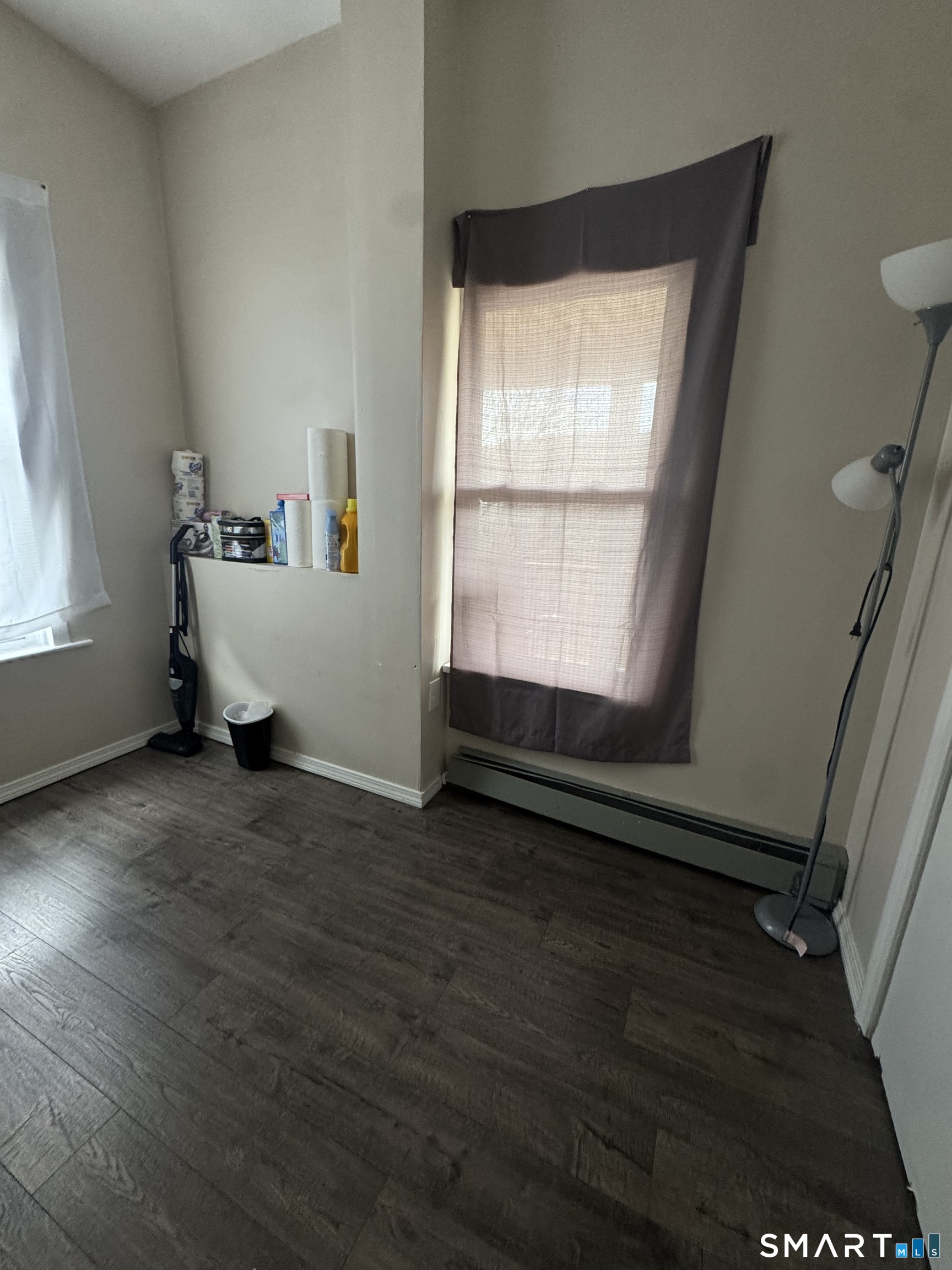 35 Cliff Street Norwich, CT 06360 - Photo 21 of 21 a view of an empty room with wooden floor and a window
