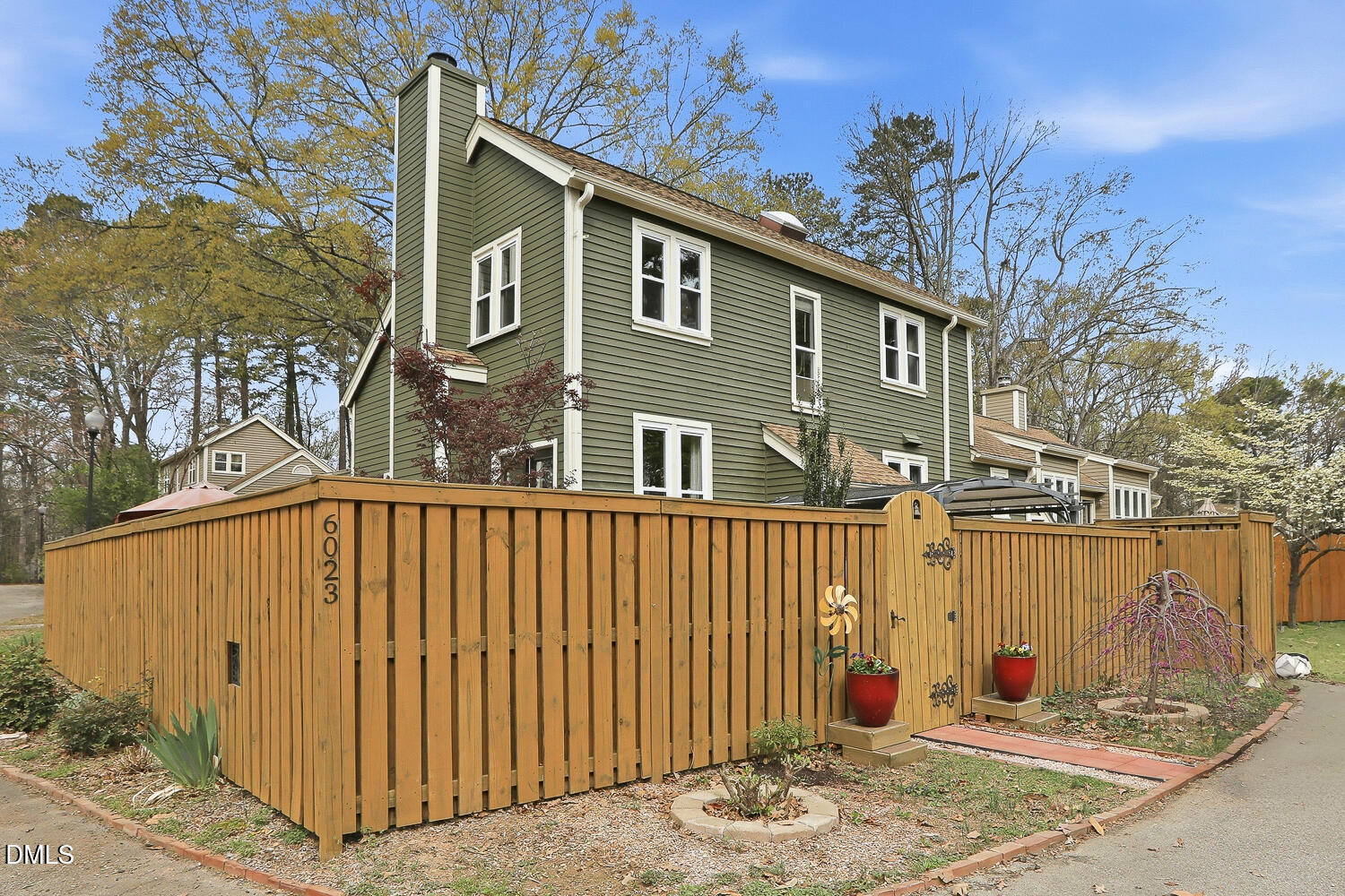6023 Sentinel Drive Raleigh, NC 27609 - Photo 1 of 53 a front view of a house with a yard