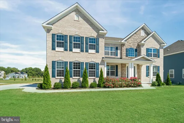 front view of a house with a yard