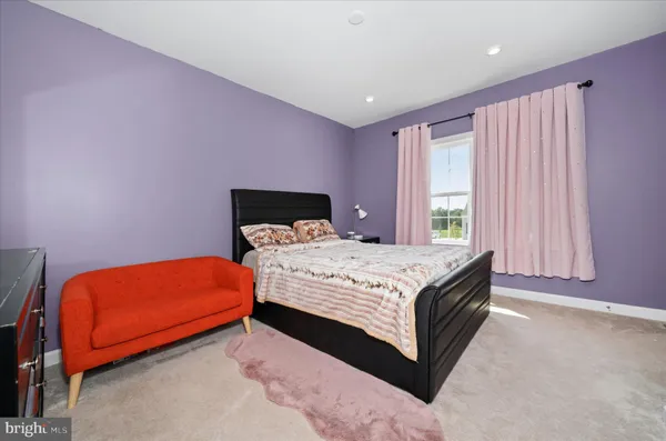 a bed room with a bed and a couch