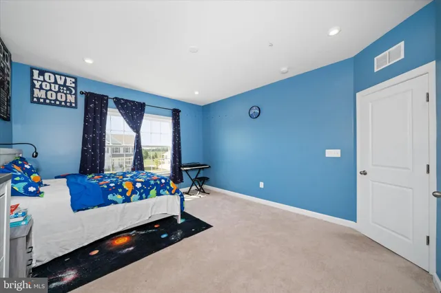 a living room with furniture and flowers