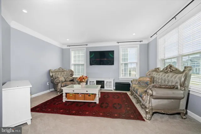 a living room with furniture window and a table
