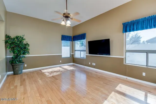 a view of a kitchen with kitchen island a counter top space appliances and cabinets