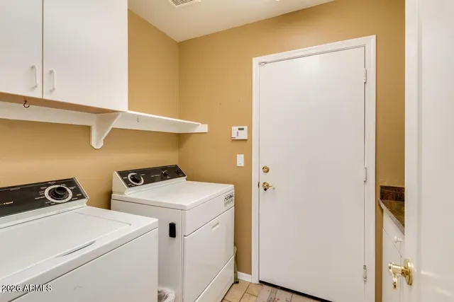 a view of a livingroom with a large window and wooden floor