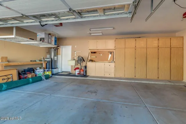 a view of a swimming pool and lounge chairs