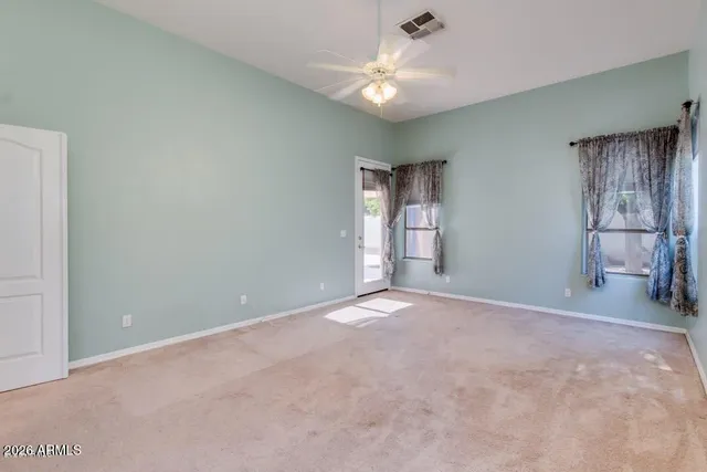 a kitchen with kitchen island granite countertop a sink cabinets and stainless steel appliances