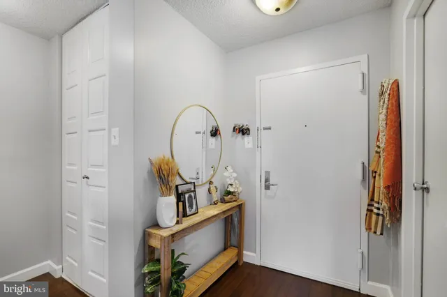 a view of living room with furniture and wooden floor