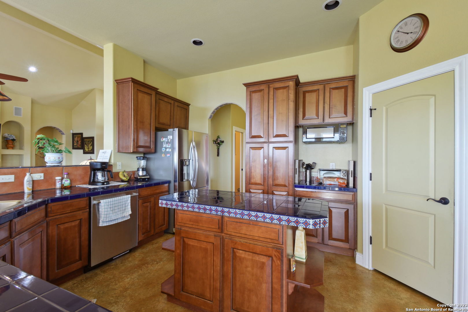 6527 Preakness Pass Bulverde, TX 78163 - Photo 11 of 22 a kitchen with stainless steel appliances granite countertop a stove and a refrigerator