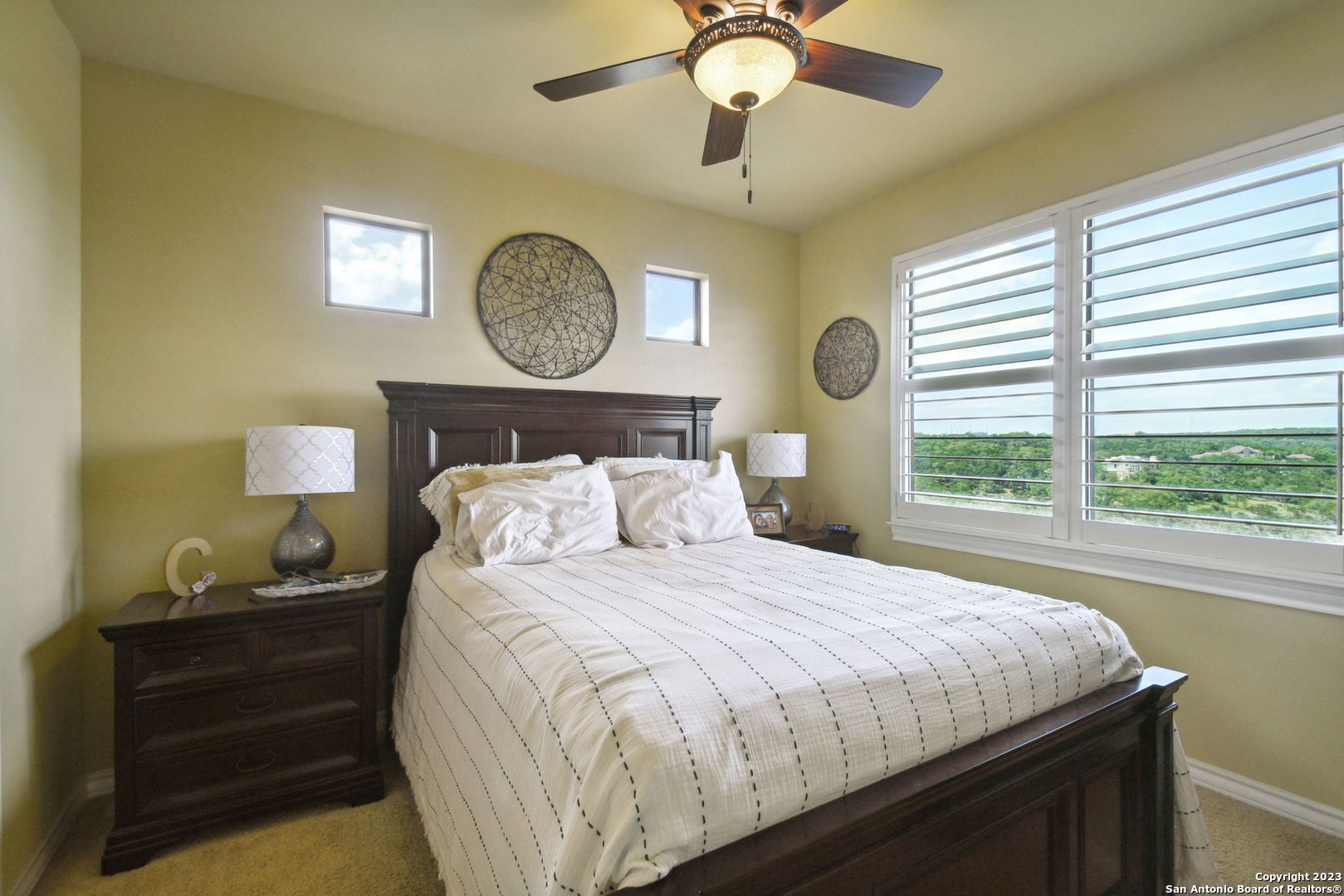 6527 Preakness Pass Bulverde, TX 78163 - Photo 20 of 22 a bedroom with a bed and a window
