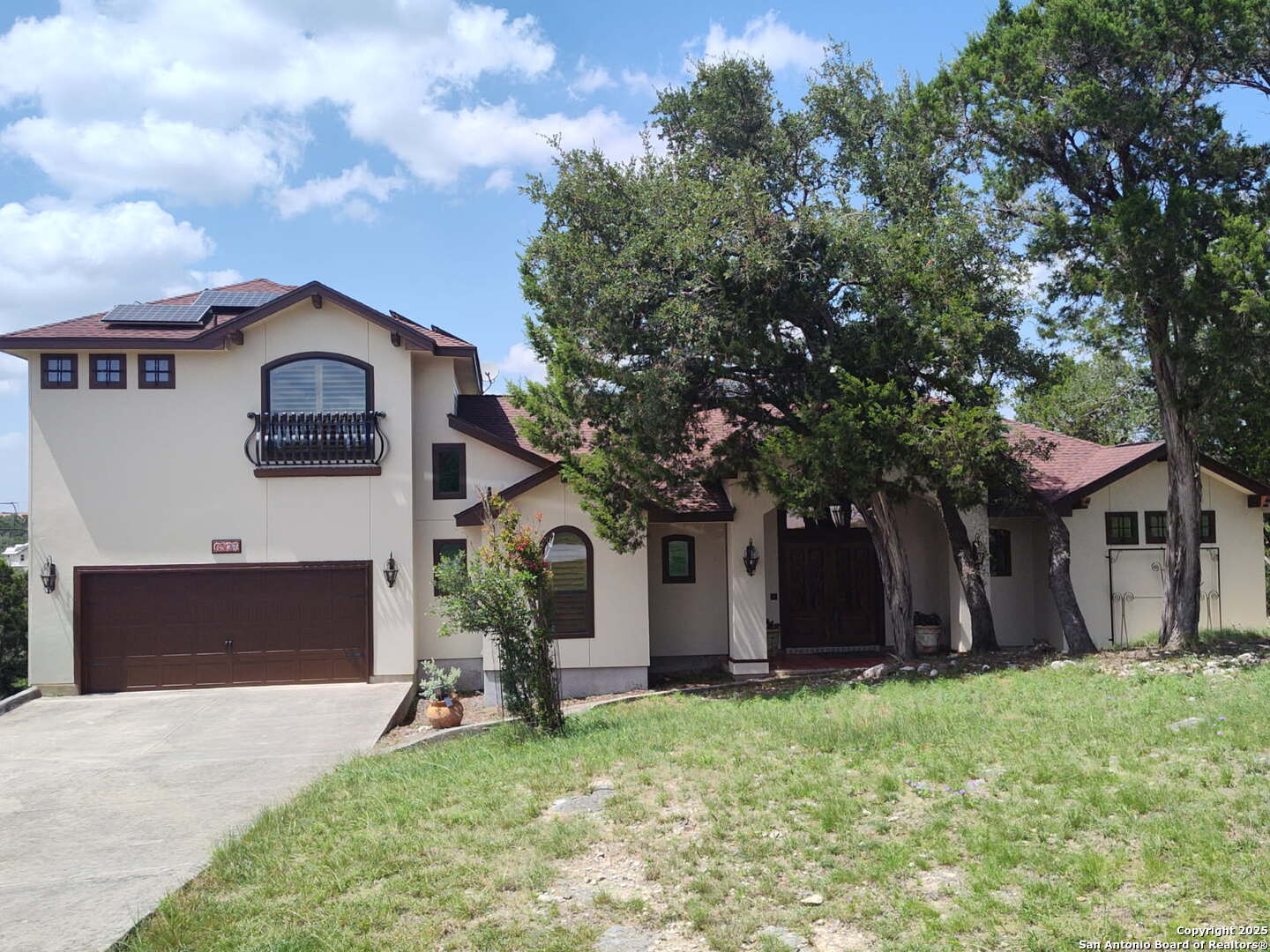 6527 Preakness Pass Bulverde, TX 78163 - Photo 2 of 22 a front view of a house with a yard and garage