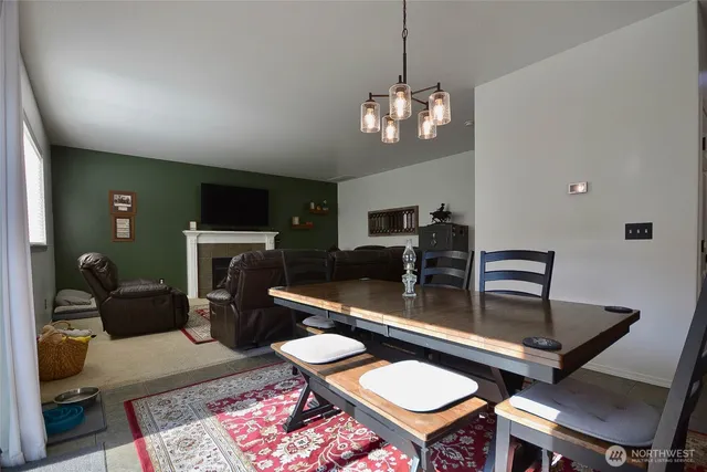 a room with furniture a rug and a chandelier