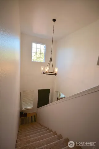 a view of a hallway with windows