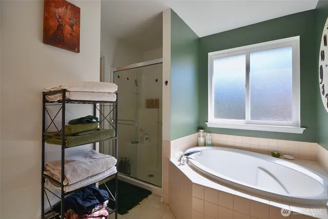 a bathroom with a tub sink and toilet