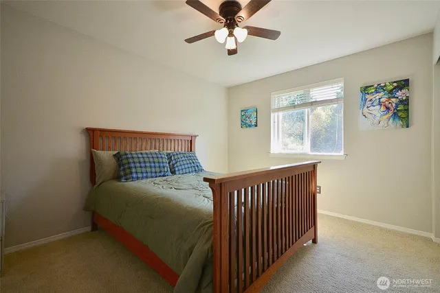 a bedroom with a bed and window