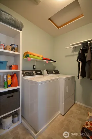 a storage room with washer and dryer