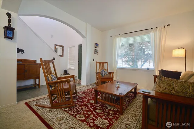 a living room with furniture and a window