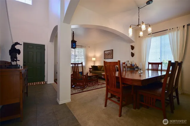a dining room with furniture and window