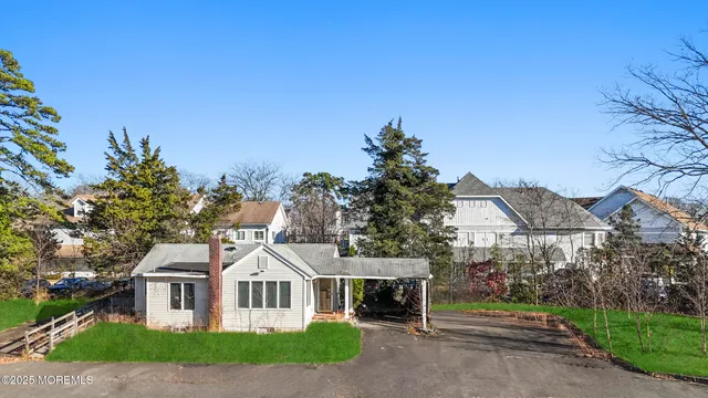 a view of house with outdoor space and garden